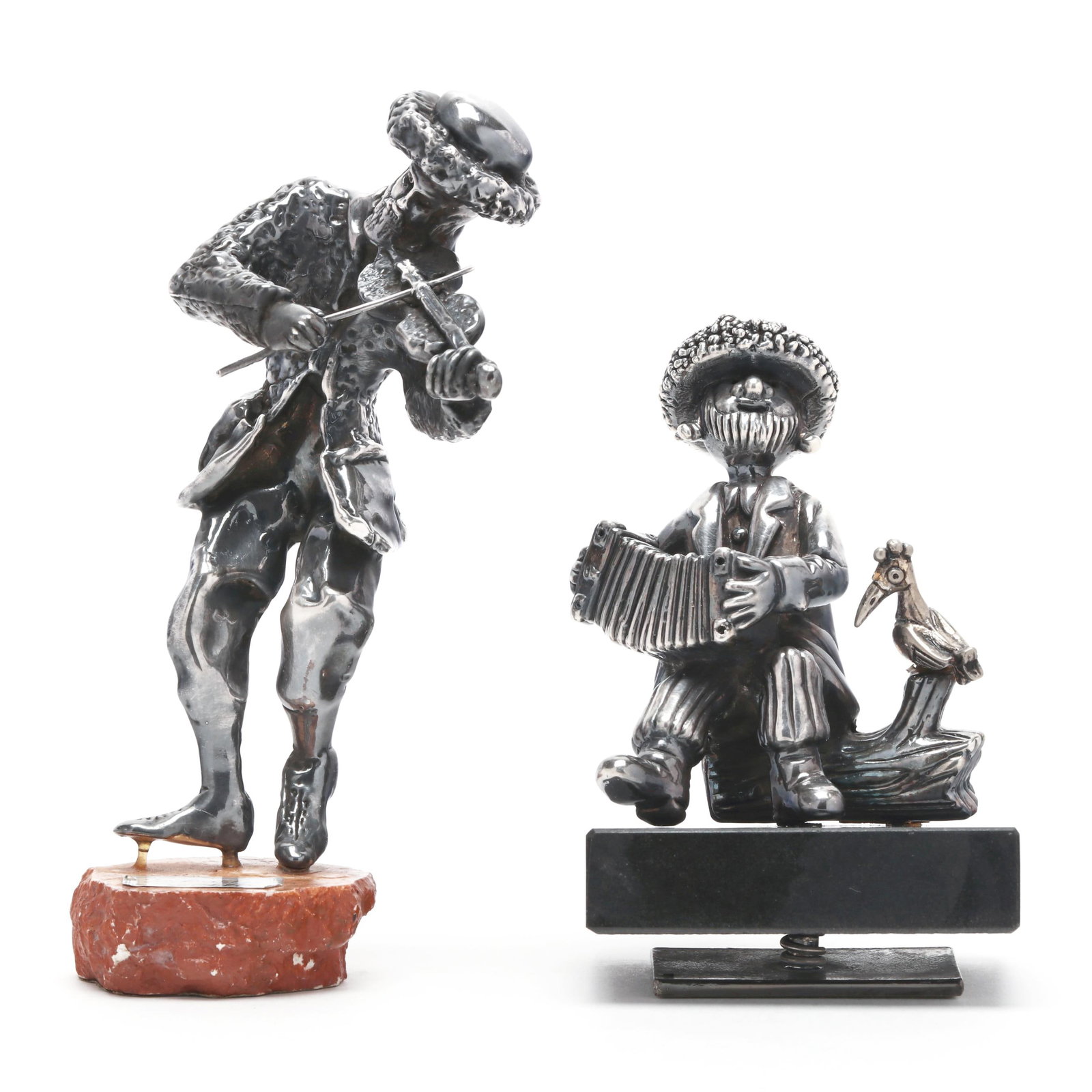 Two Israeli Silver Figures, Marks of Jay Avishay and Frank Meisler: Two Israeli Silver Figures, Marks of Jay Avishay and Frank Meisler includes a violinist figure by Jay Avishay (7 in.) and a seated accordion figure by Frank Meisler (5 1/4 x 3 1/4 x 2 1/2 in.);