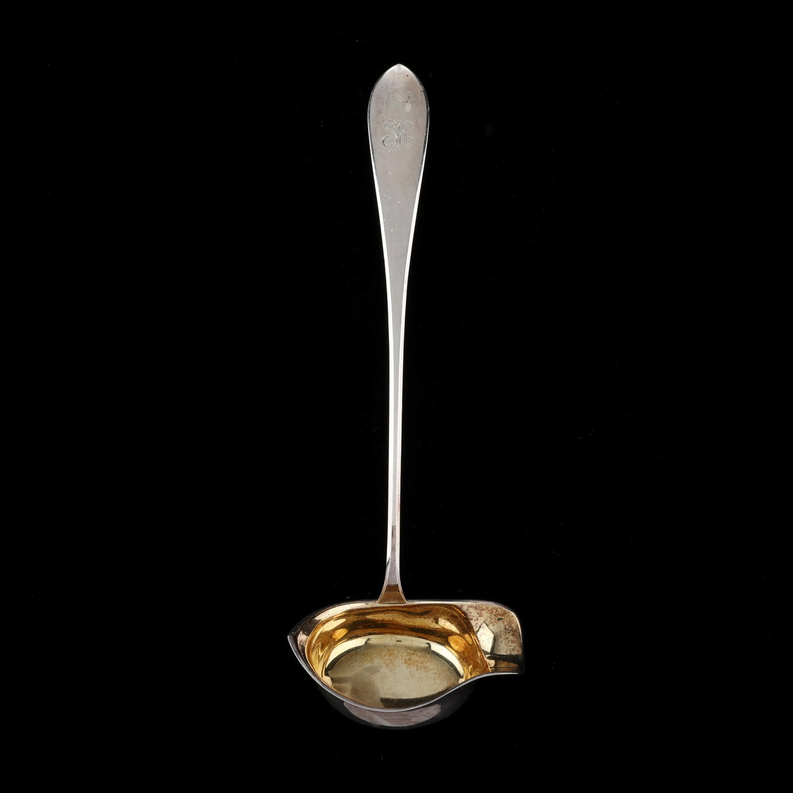 FInnish Silver Toddy Ladle: FInnish Silver Toddy Ladle .813 silver, date mark of 1935, featuring a gold wash bowl, monogrammed. 12 in. 4.05 troy oz. Additional high-resolution photos are available at www.lelandlittle.com