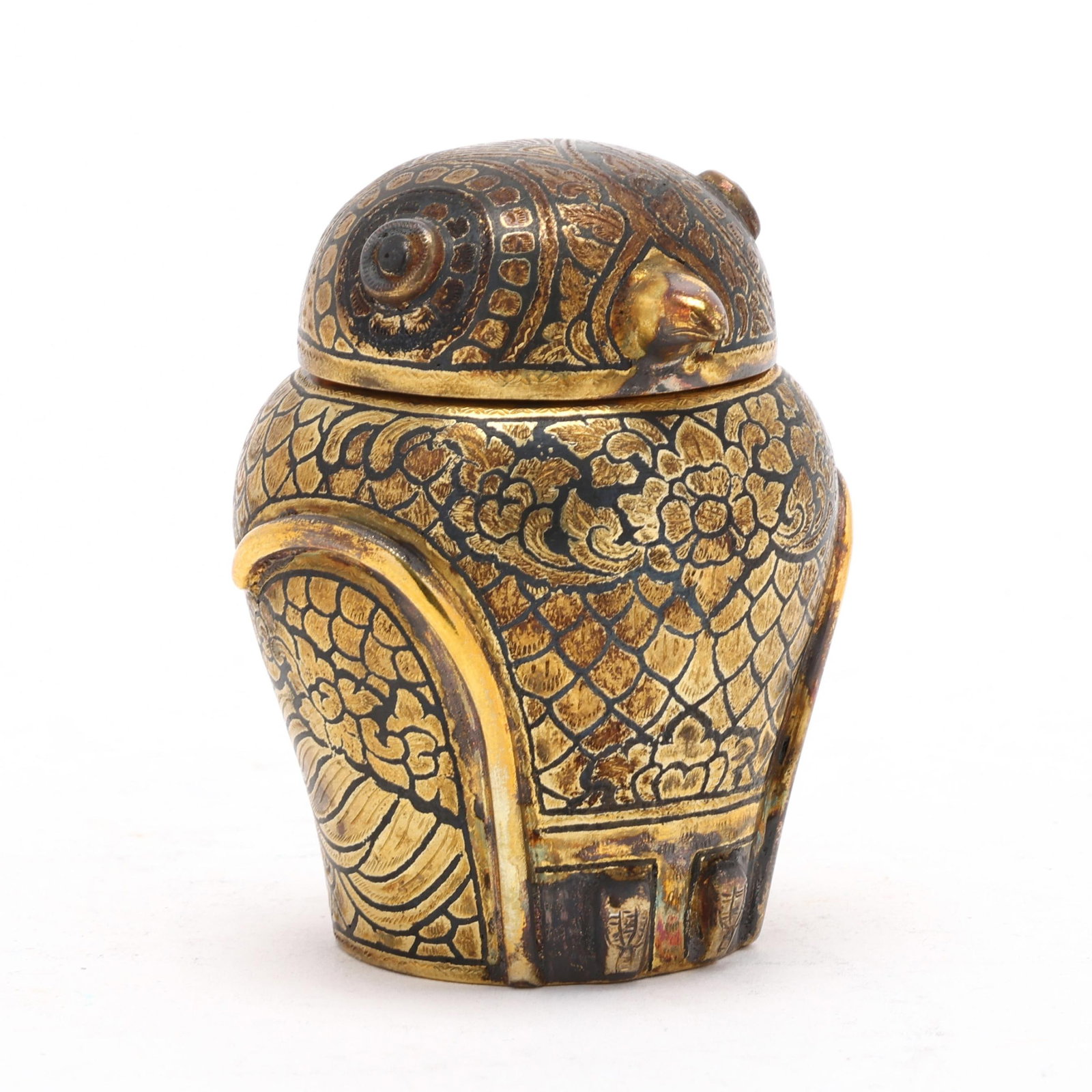 Thai Niello and Gold-Plated Silver Owl Box: Thai Niello and Gold-Plated Silver Owl Box late 20th century, betel box in the form of a seated owl with niello, gilt, and chased decoration, marked. 3 x 2 1/2 x 2 1/2 in. 2.75 troy oz. Additional