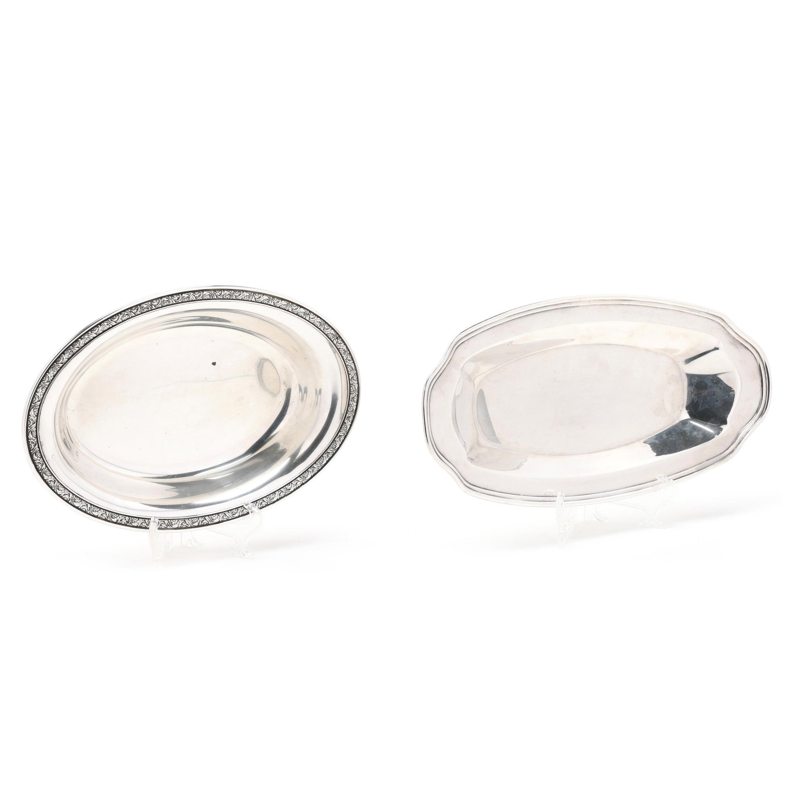 Two American Sterling Silver Bread Trays: Two American Sterling Silver Bread Trays the first, mark of Alvin, pattern number S158, with a foliate relief decorated rim, not monogrammed (7 1/2 x 10 3/4 in.); the second, marked "Sterling", with a