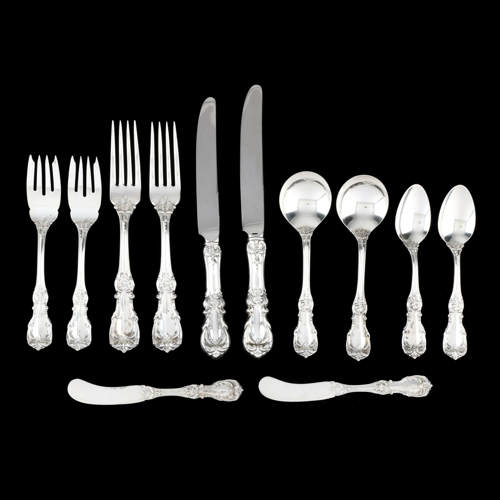 Twelve Pieces of Reed & Barton Burgundy Sterling Silver Flatware: Twelve Pieces of Reed & Barton Burgundy Sterling Silver Flatware includes (2) place settings each with a dinner knife (9 5/8 in.); dinner fork (7 3/4 in.); salad fork (6 1/2 in.); teaspoon (6 in.);