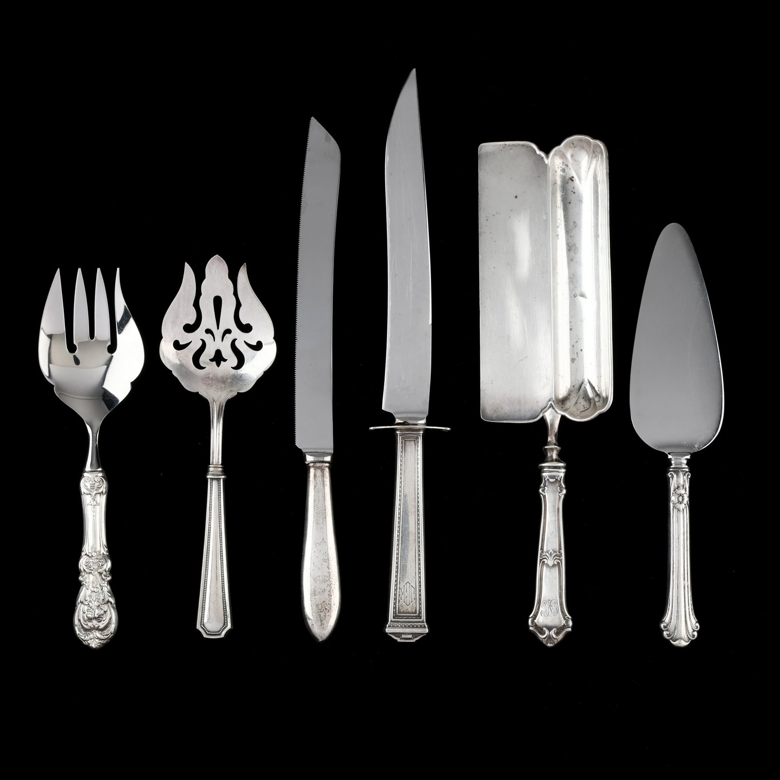 Six American Sterling Silver Handled Flatware Servers: Six American Sterling Silver Handled Flatware Servers includes a Reed & Barton Francis I salad serving fork; an International Pantheon carving knife; a pointed handled wedding cake knife; a Wallace