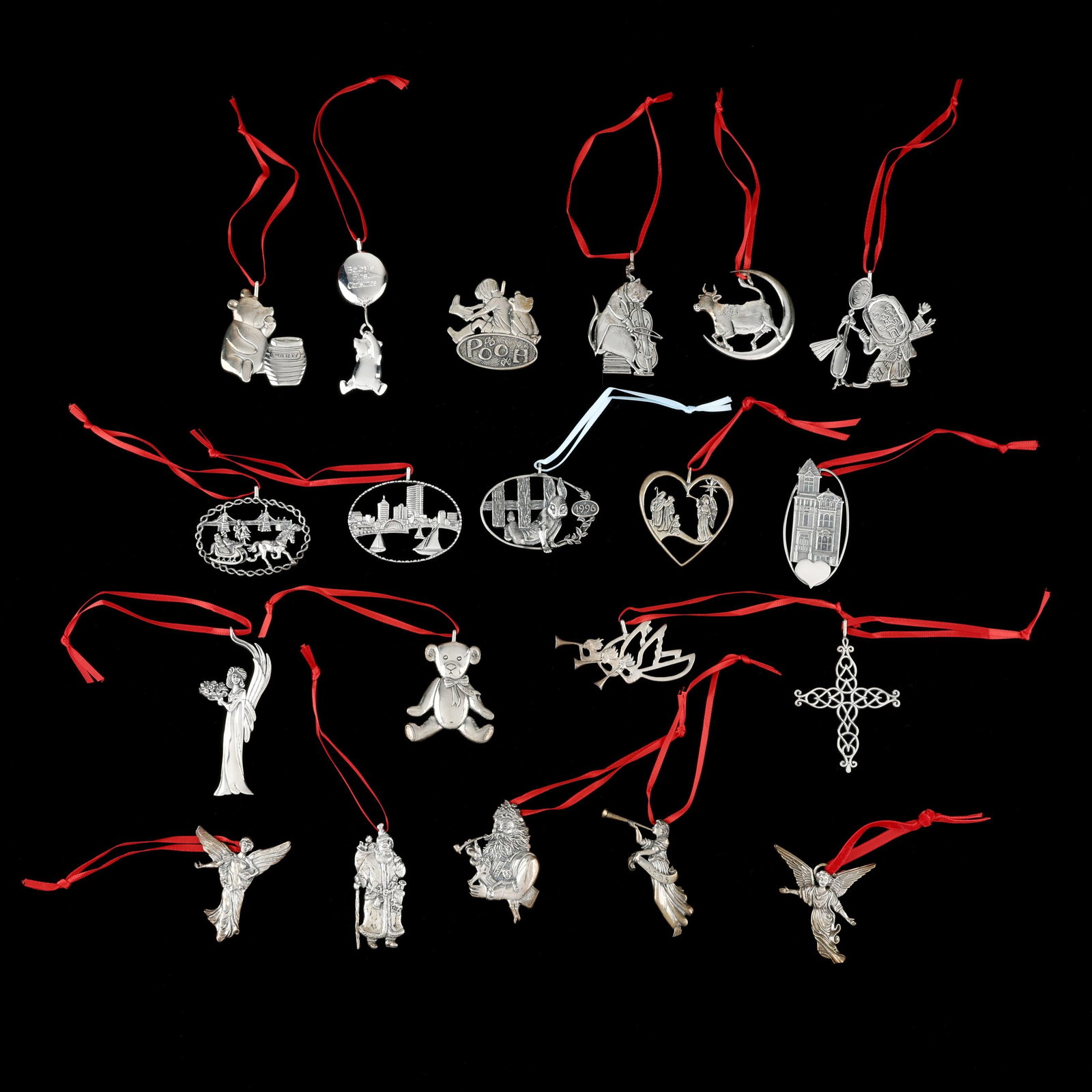 Twenty Hand & Hammer Sterling Christmas Ornaments: Twenty Hand & Hammer Sterling Christmas Ornaments late 20th and early 21st century, includes carious motifs from Winnie the Pooh, nursery rhymes, and other holiday symbols. Not monogrammed, presented