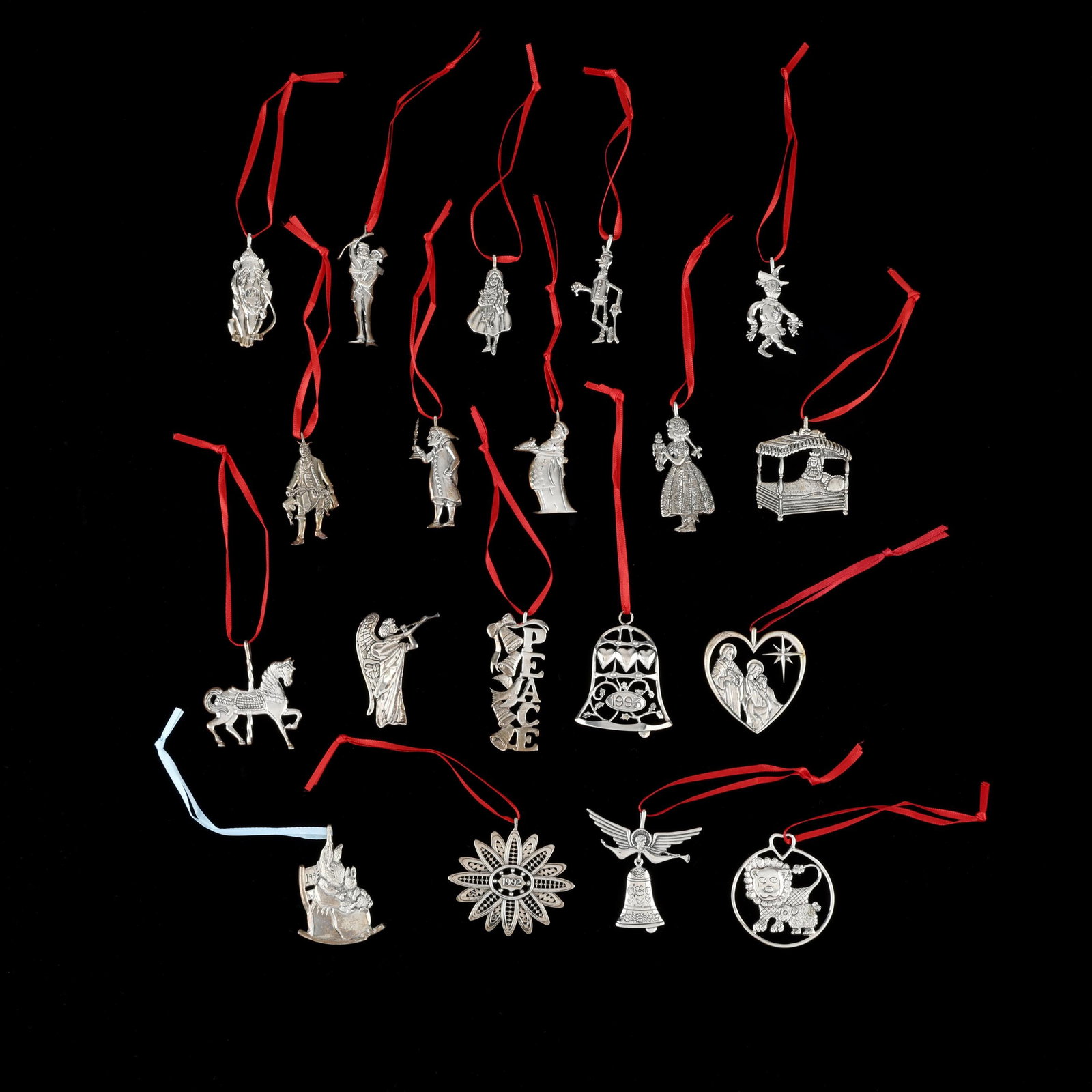 Nineteen Hand & Hammer Sterling Silver Christmas Ornaments: Nineteen Hand & Hammer Sterling Silver Christmas Ornaments late 20th and early 21st century, including various motifs associated with A Christmas Carol, Peter Rabbit, the Nutcracker, and other
