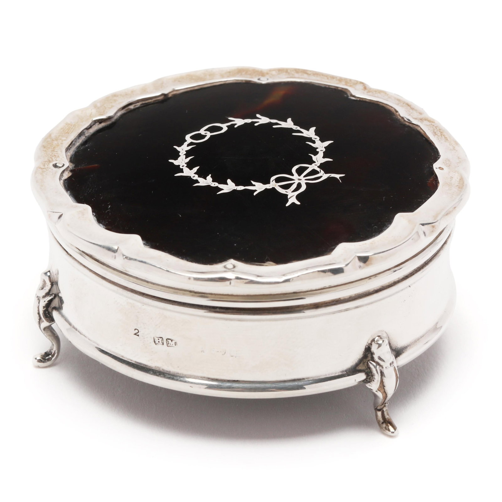 George V Silver and Tortoiseshell Jewelry Box: George V Silver and shell Jewelry Box Birmingham (1918), mark of Henry Matthews, scalloped edge with inlaid wreath decoration, raised on three cartouche feet, interior lined with felt, not