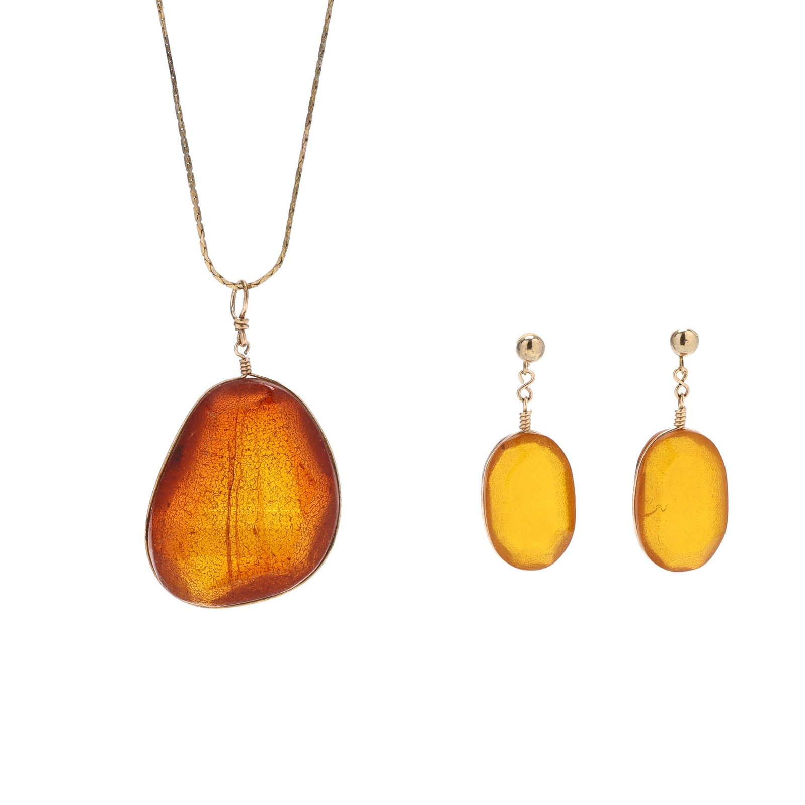 Amber Pendant Necklace and Dangle Earrings: Amber Pendant Necklace and Dangle Earrings the gold-tone cobra link necklace, completed with a spring ring clasp, suspending a large, faceted, amber pendant in gold-tone wire setting, and completed
