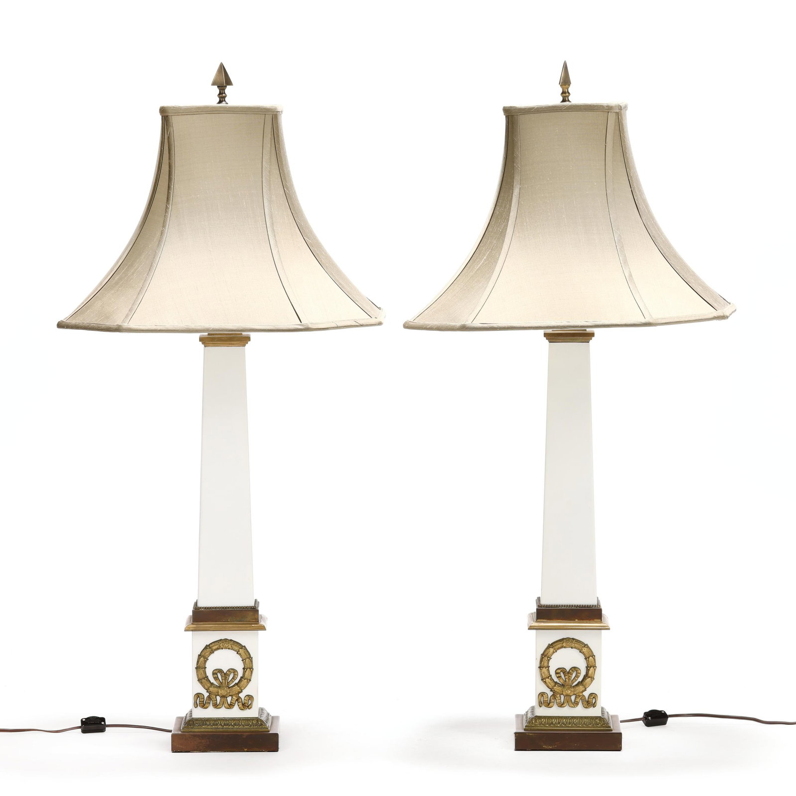 Pair of Neoclassical Style Tole Obelisk Lamps: Pair of Neoclassical Style Tole Obelisk Lamps 20th century, ormolu brass mounted white painted tole, with fabric shades, not labeled. 38 x 18 1/4 x 18 1/4 in. From the Collection of Mike & Gail Kansle