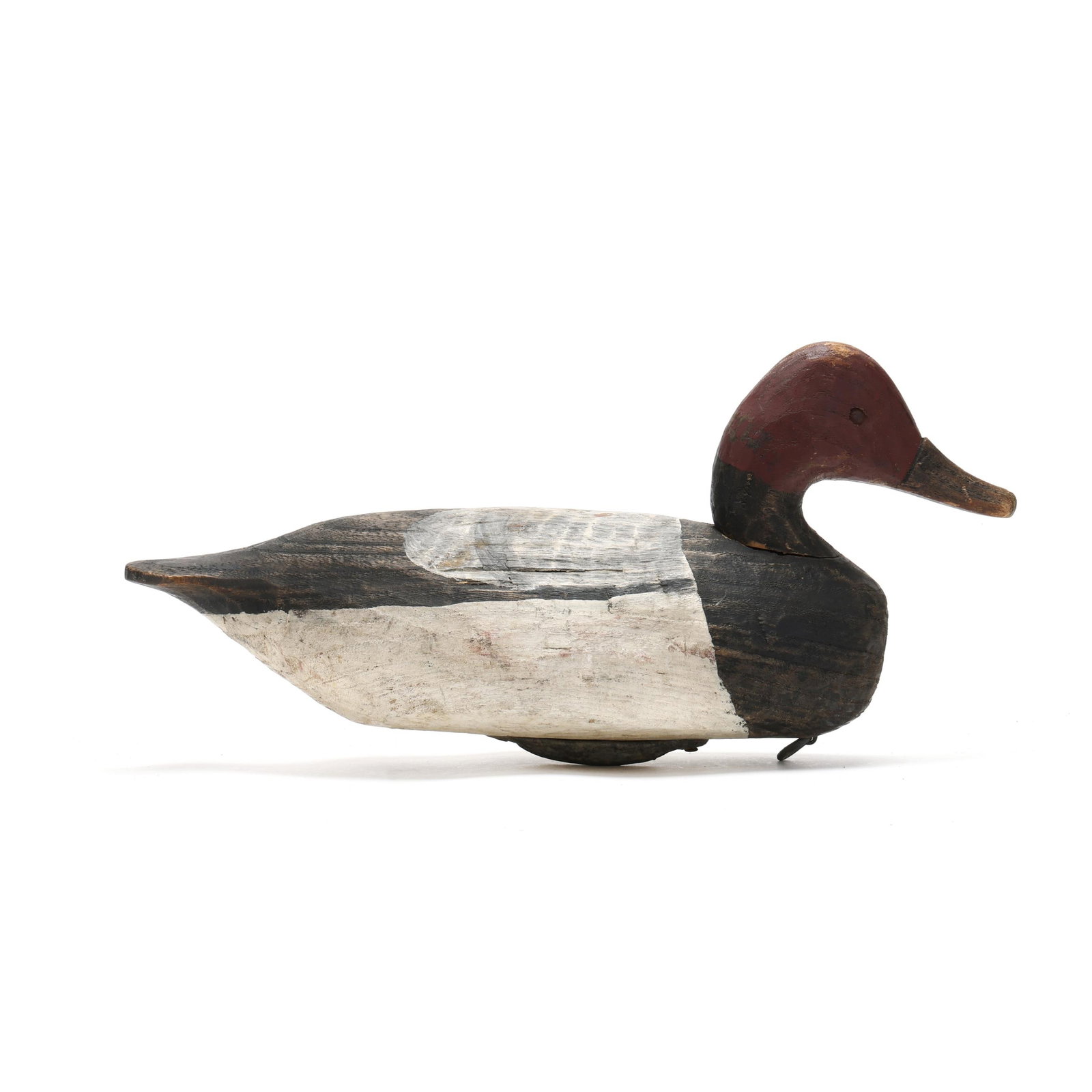 Miles Hancock (VA, 1887-1974), Canvasback: Miles Hancock (VA, 1887-1974), Canvasback Chincoteague, Virginia, circa 1940s, carved and painted wood, tack eyes. Length 16.5 in. x 8.5 x 6.5 From a Private Collection donated to benefit the conserva