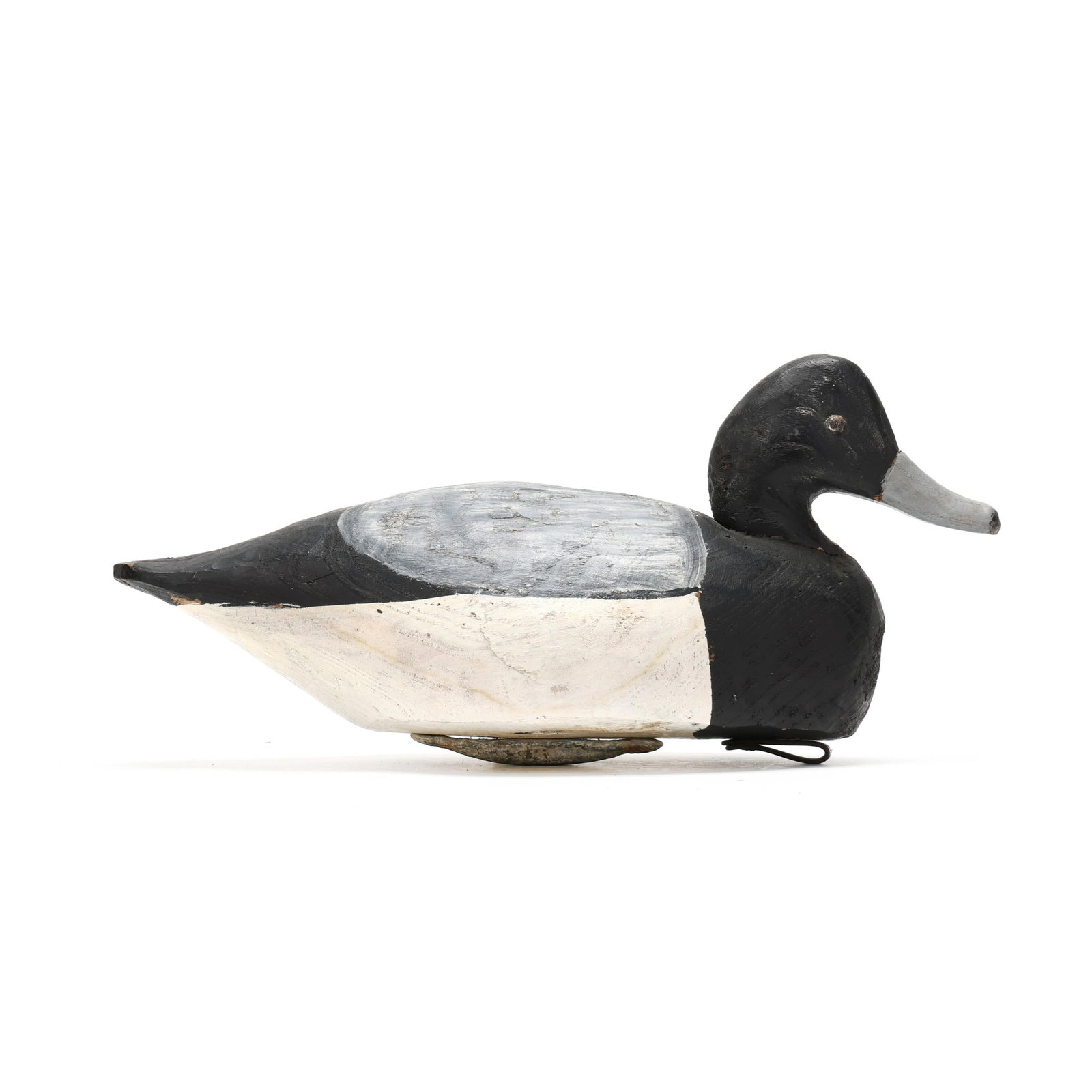 Miles Hancock (VA, 1887-1974), Bluebill: Miles Hancock (VA, 1887-1974), Bluebill Chincoteague, Virginia, circa 1950, carved and painted wood, makers stamp on the bottom, tack eyes. Length 15 in. x 7 x 6 From a Private Collection donated to b