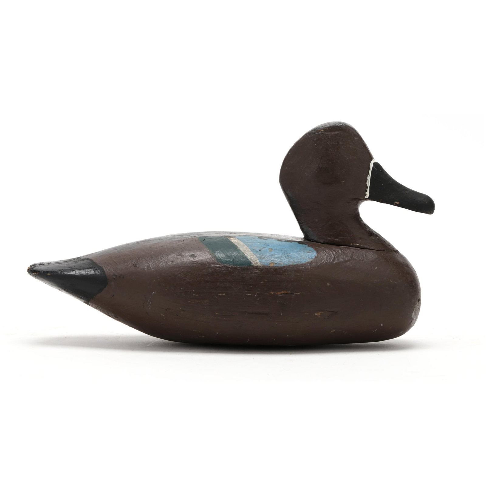 Early Louisiana Blue-winged Teal: Early Louisiana Blue-winged Teal Probably from the Bayou Terrebonne area, circa 1940s, carved and painted wood, branded J. Length 11.5 in. x 6.5 x 4.5 Additional high-resolution photos are available a