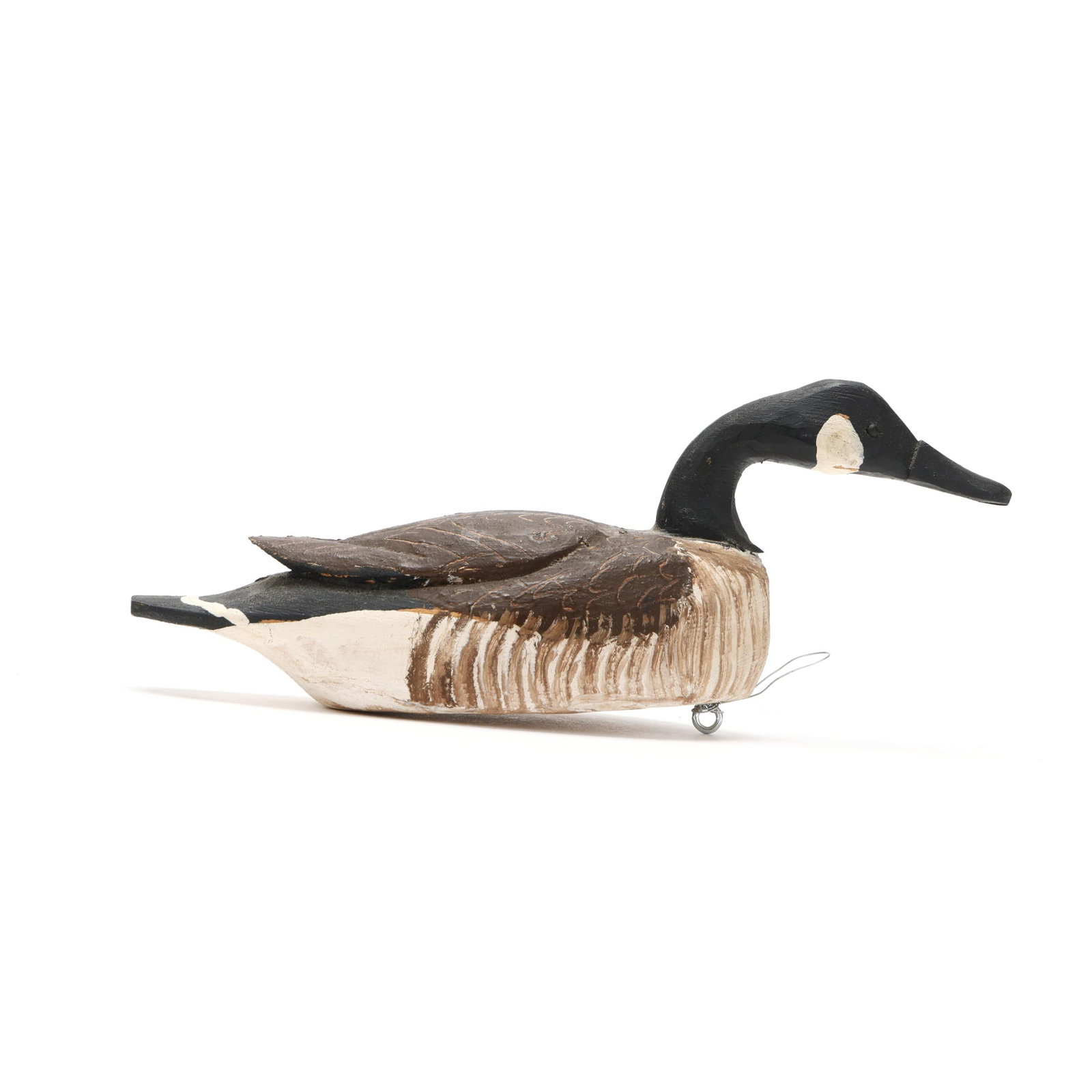 Miles Hancock (VA, 1887-1974), Miniature Hissing Goose: Miles Hancock (VA, 1887-1974), Miniature Hissing Goose Chincoteague, Virginia, circa 1960s, carved and painted wood, signed. Length 7 in. x 3 x 2.5 Nice wing relief carving and scratch feather paintin