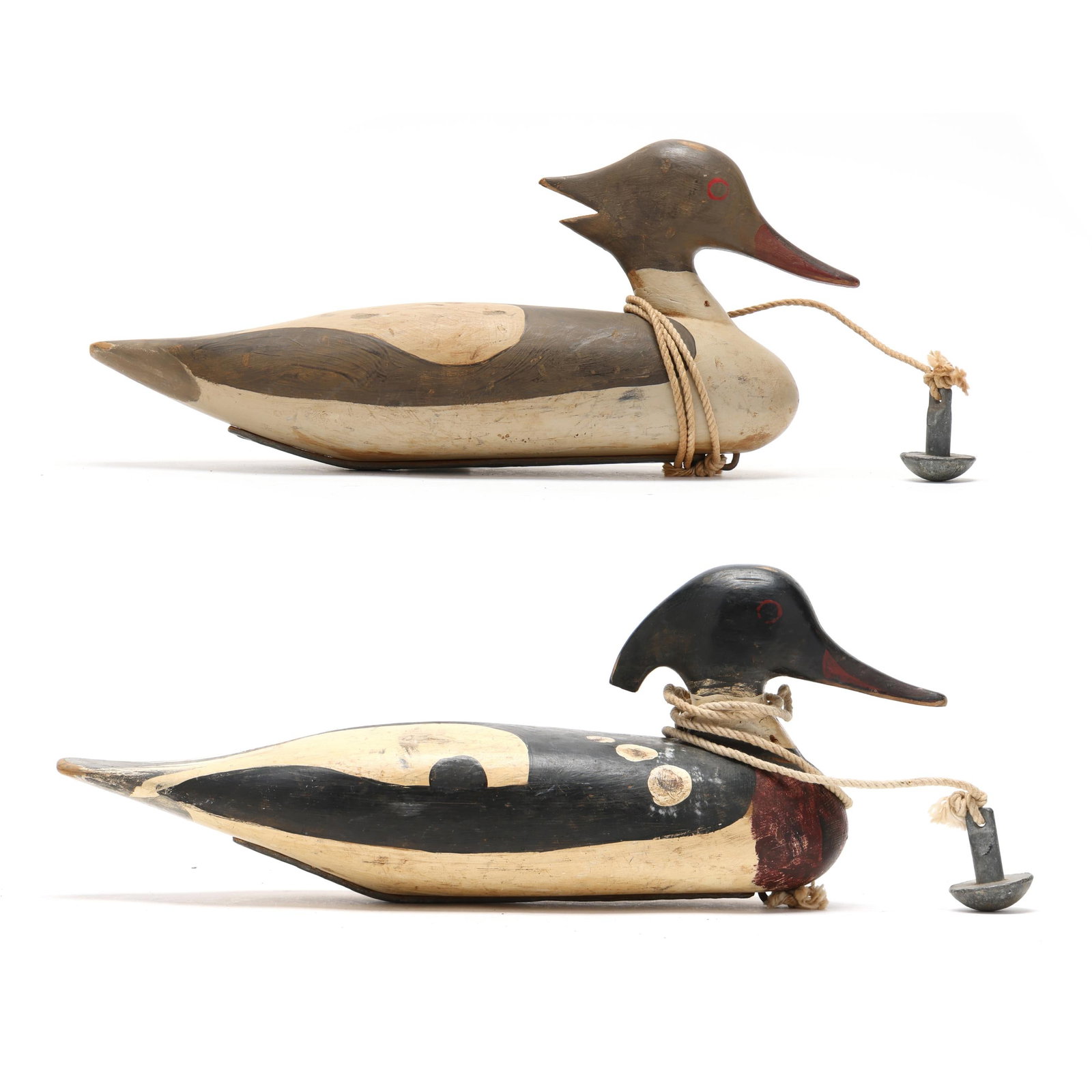 Early Pair Red Breasted Mergansers: Early Pair Red Breasted Mergansers New England, circa 1920, carved and painted wood, having the anchor rigging. Length 17 in. x 7 x 6 From a Private Collection donated to benefit the conservation