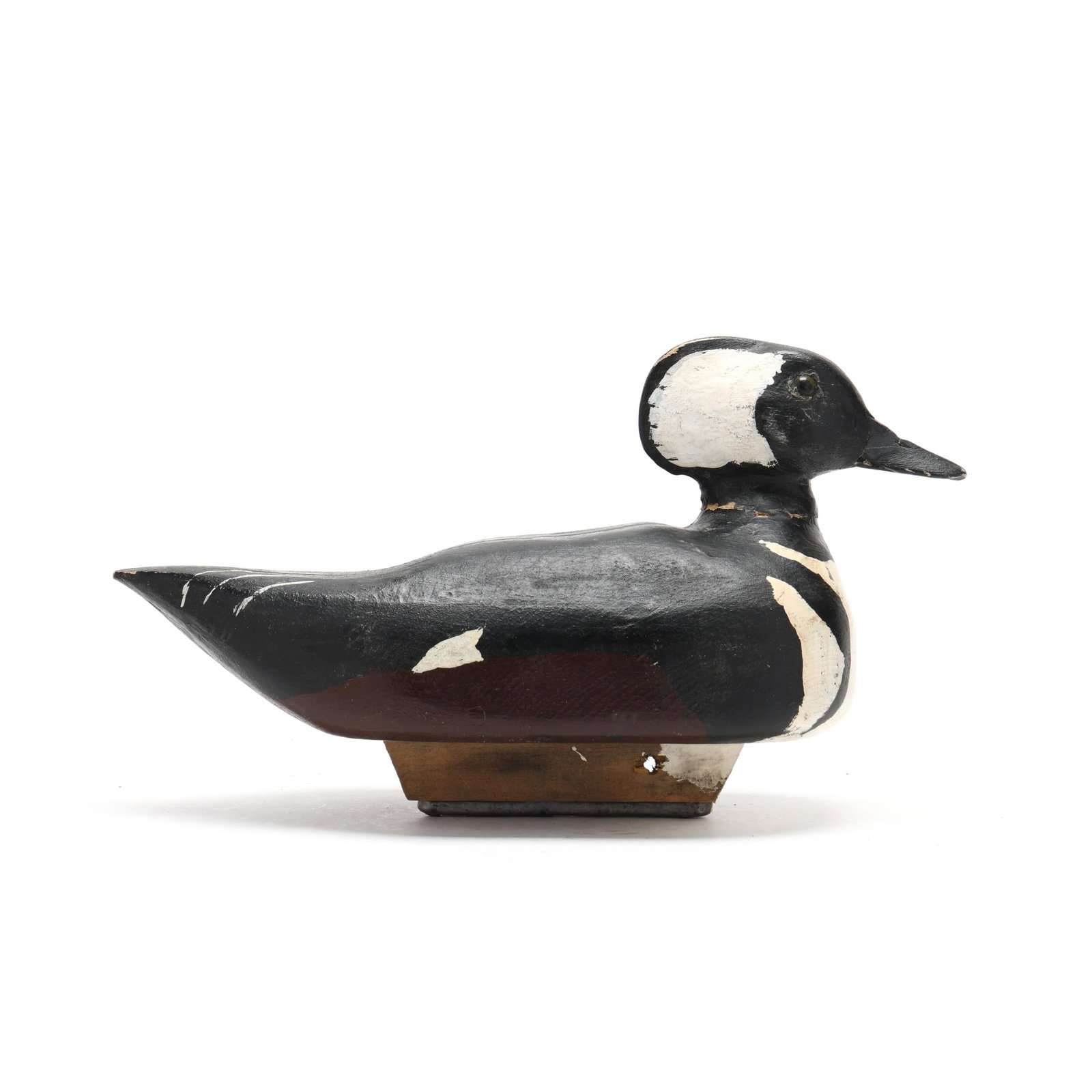 Early Hooded Merganser: Early Hooded Merganser Probably Nova Scotia, circa 1940s, carved and painted wood, glass eyes, illegible incised brand. Length 12 in. x 7 x 5 From a Private Collection donated to benefit the conservat