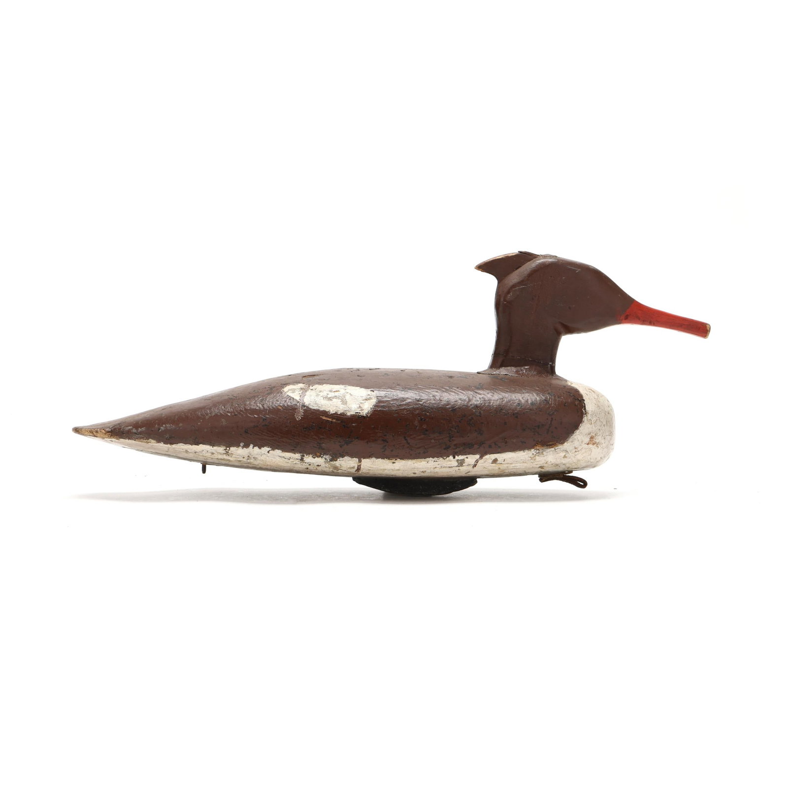 Early Maine Hen Merganser: Early Maine Hen Merganser Coastal Maine, circa 1930s, carved and painted wood. Length 18 in. x 7.5 x 6 From a Private Collection donated to benefit the conservation efforts of Ducks Unlimited, Inc.