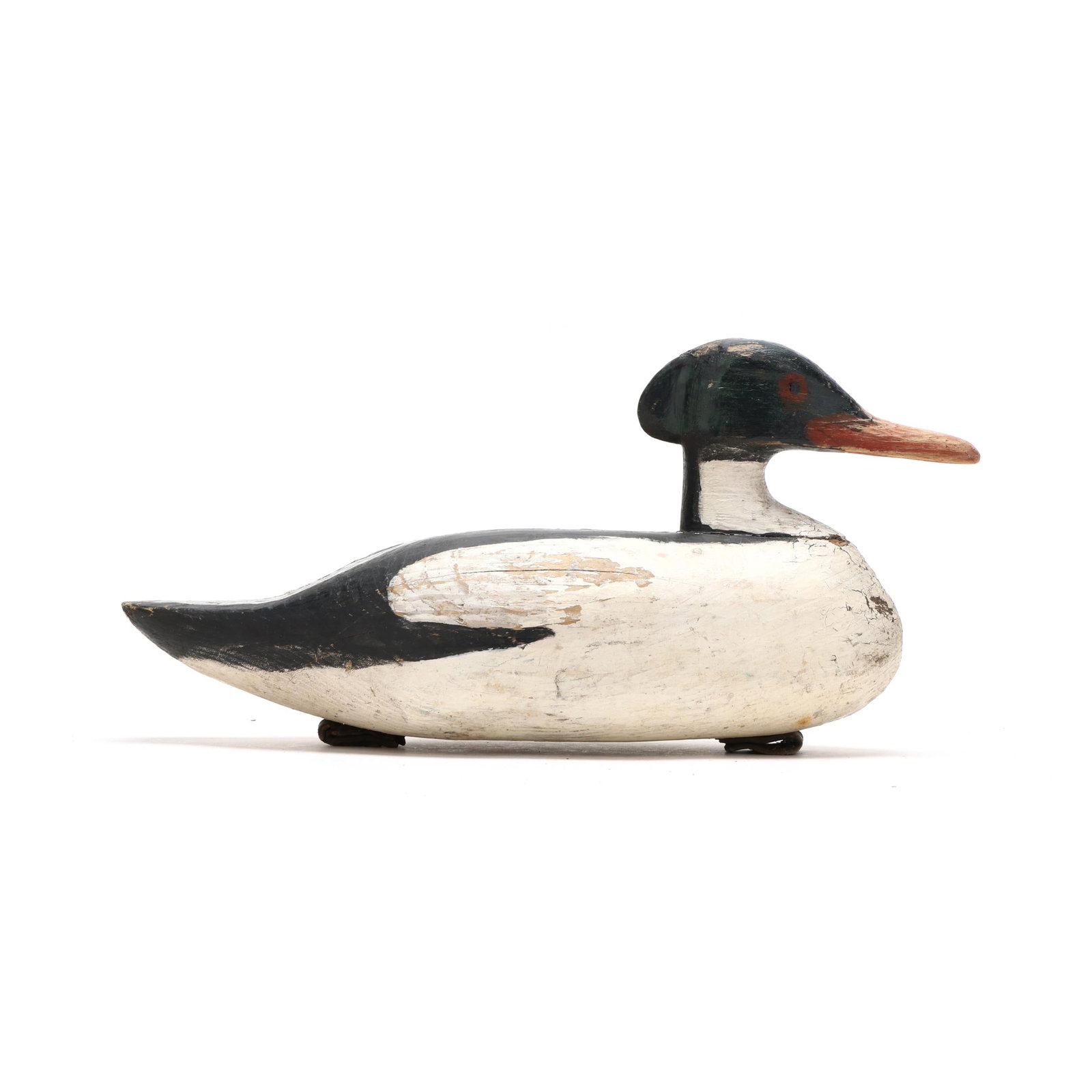 Early Common Merganser: Early Common Merganser Probably New England, circa 1930s, carved and painted wood. Length 17 in. x 8.5 x 8 Carved brow in the head extends to the crest. From a Private Collection donated to benefit