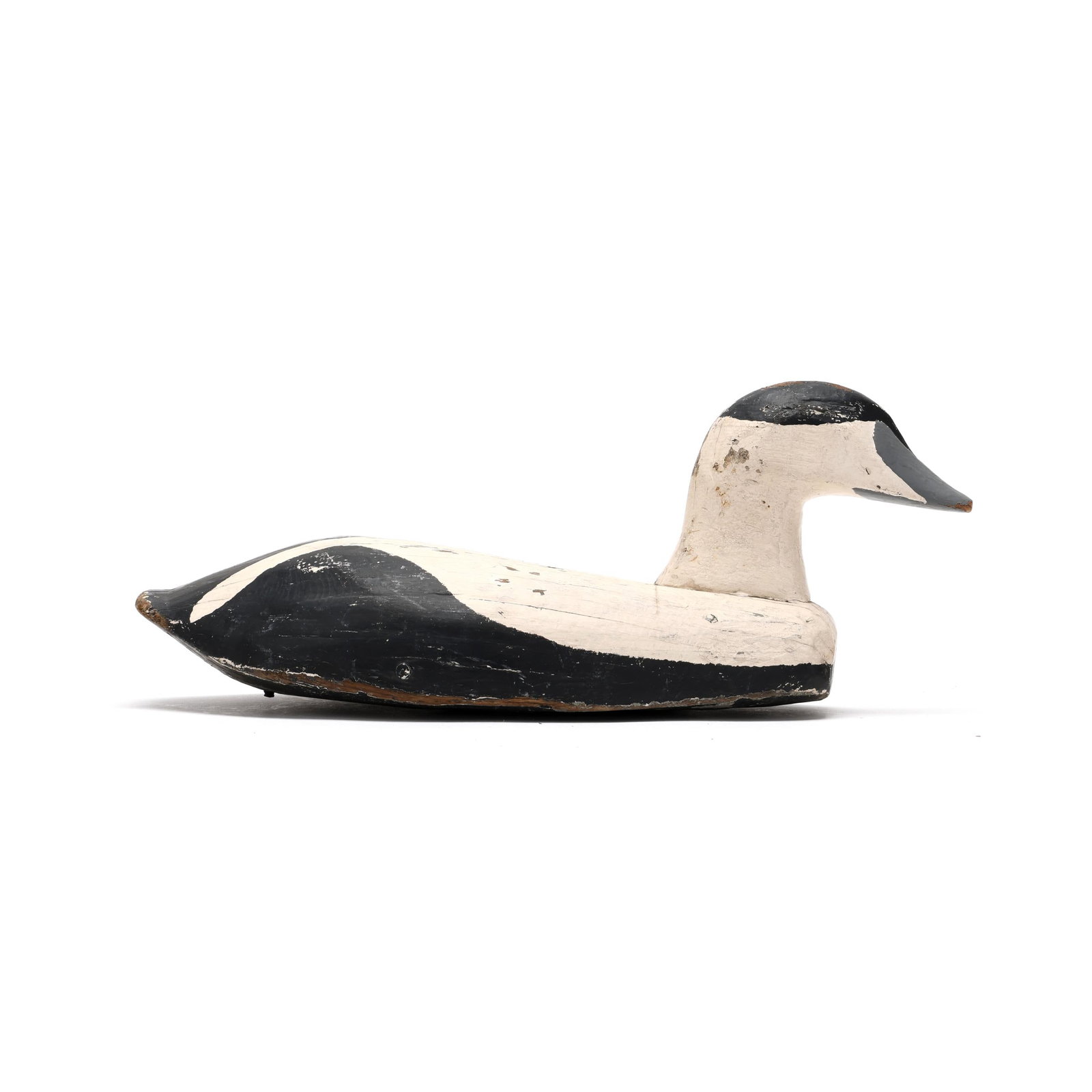 Early Eider: Early Eider Coastal Maine, circa 1920s, carved and painted woodd. Length 17 in. x 7 x 7.5 From a Private Collection donated to benefit the conservation efforts of Ducks Unlimited, Inc. Additional