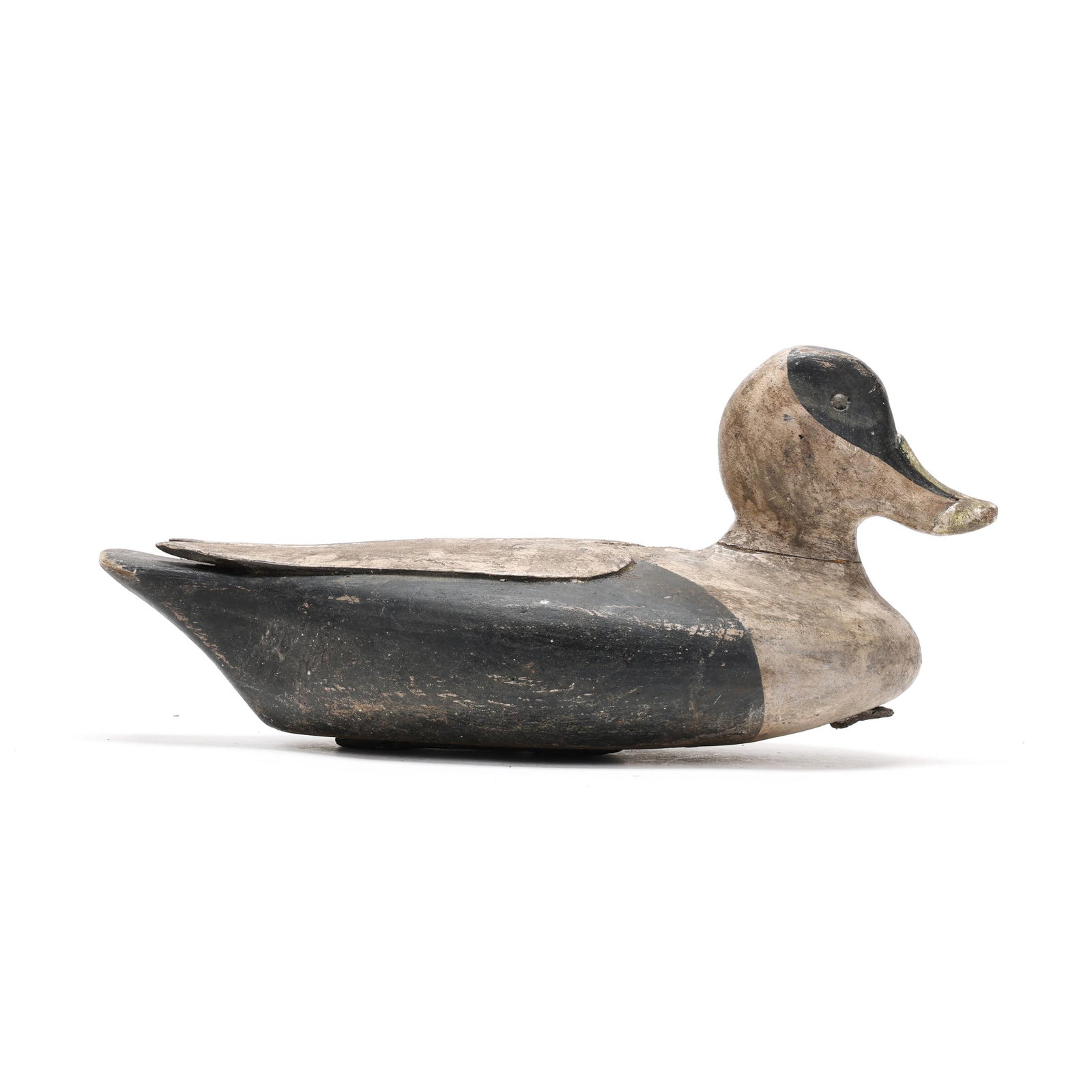 Early Folksy Eider: Early Folksy Eider Probably New England, circa 1920s, carved and painted wood, tack eyes. Length 15 in. x 7.5 x 7.5 Wing relief carving. From a Private Collection donated to benefit the conservation