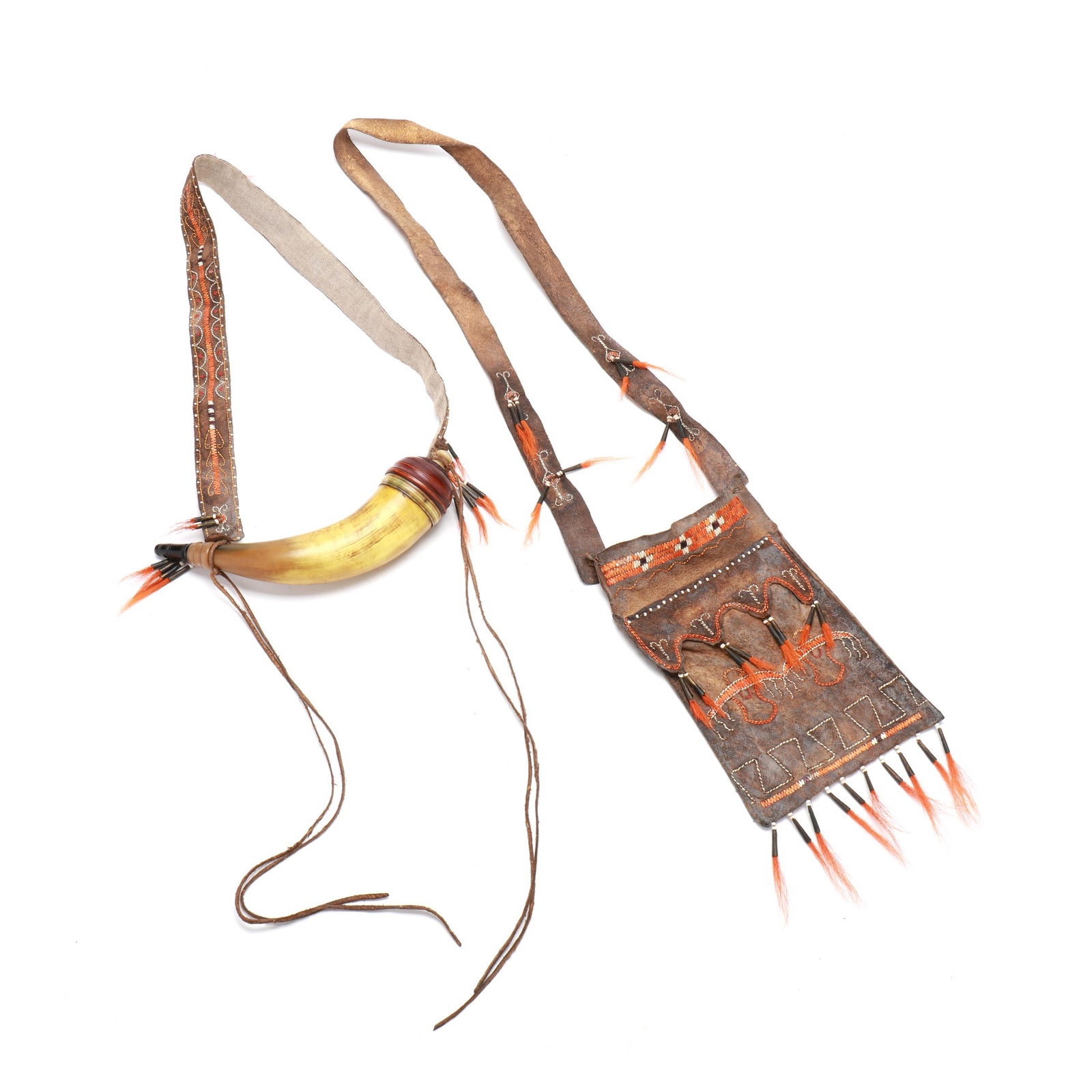 Contemporary Powder Horn and Decorated Leather Bag: Contemporary Powder Horn and Decorated Leather Bag circa 1980s, carved horn and wood, tooled and decorated leather. Horn length 10 in. x 2.5 Leather Bag length 7 in. x 9 Additional high-resolution pho
