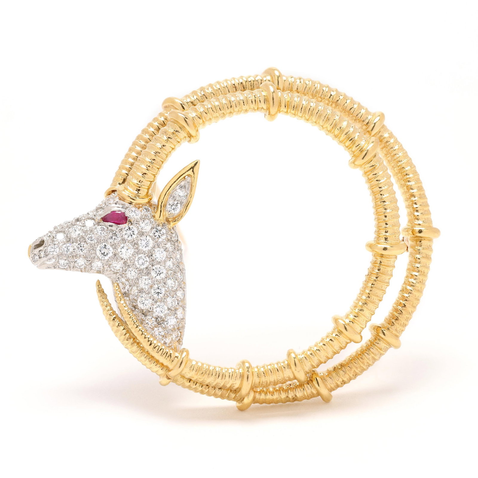 Gold, Platinum, Diamond, and Ruby Ibex Motif Brooch, Schlumberger for Tiffany & Co.: Gold, Platinum, Diamond, and Ruby Ibex Motif Brooch, Schlumberger for Tiffany & Co. designed as the head of an ibex in white gold facing left and pavé set with full cut round diamonds weighing approx