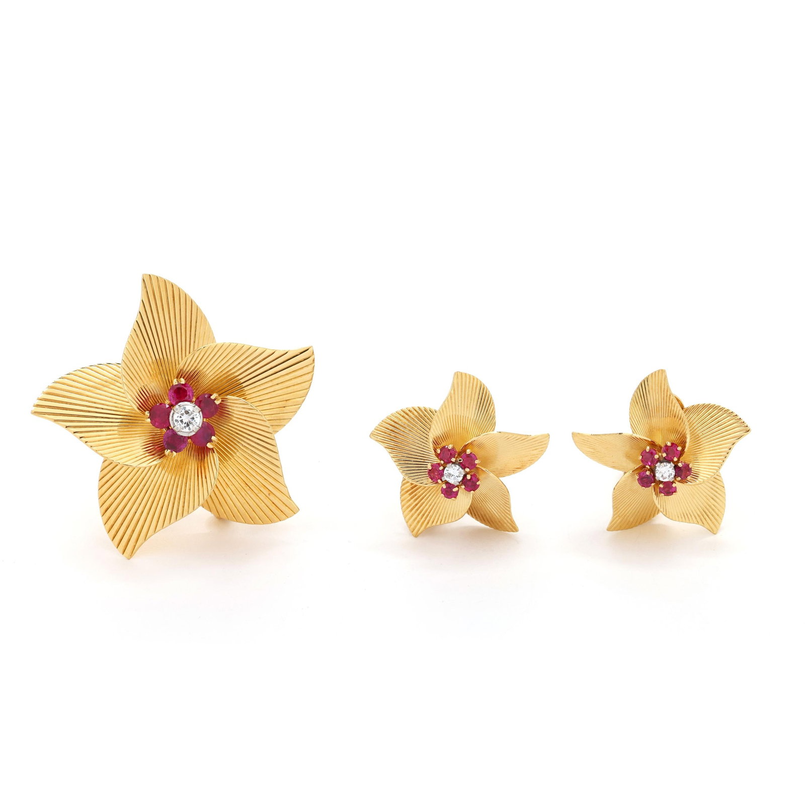 Retro Gold, Ruby, and Diamond Flower Motif Brooch and Earrings, Tiffany & Co.: Retro Gold, Ruby, and Diamond Flower Motif Brooch and Earrings, Tiffany & Co. to include: a flower design brooch with fluted petals and the center with a full cut round diamond (3.5mm) prong set in wh