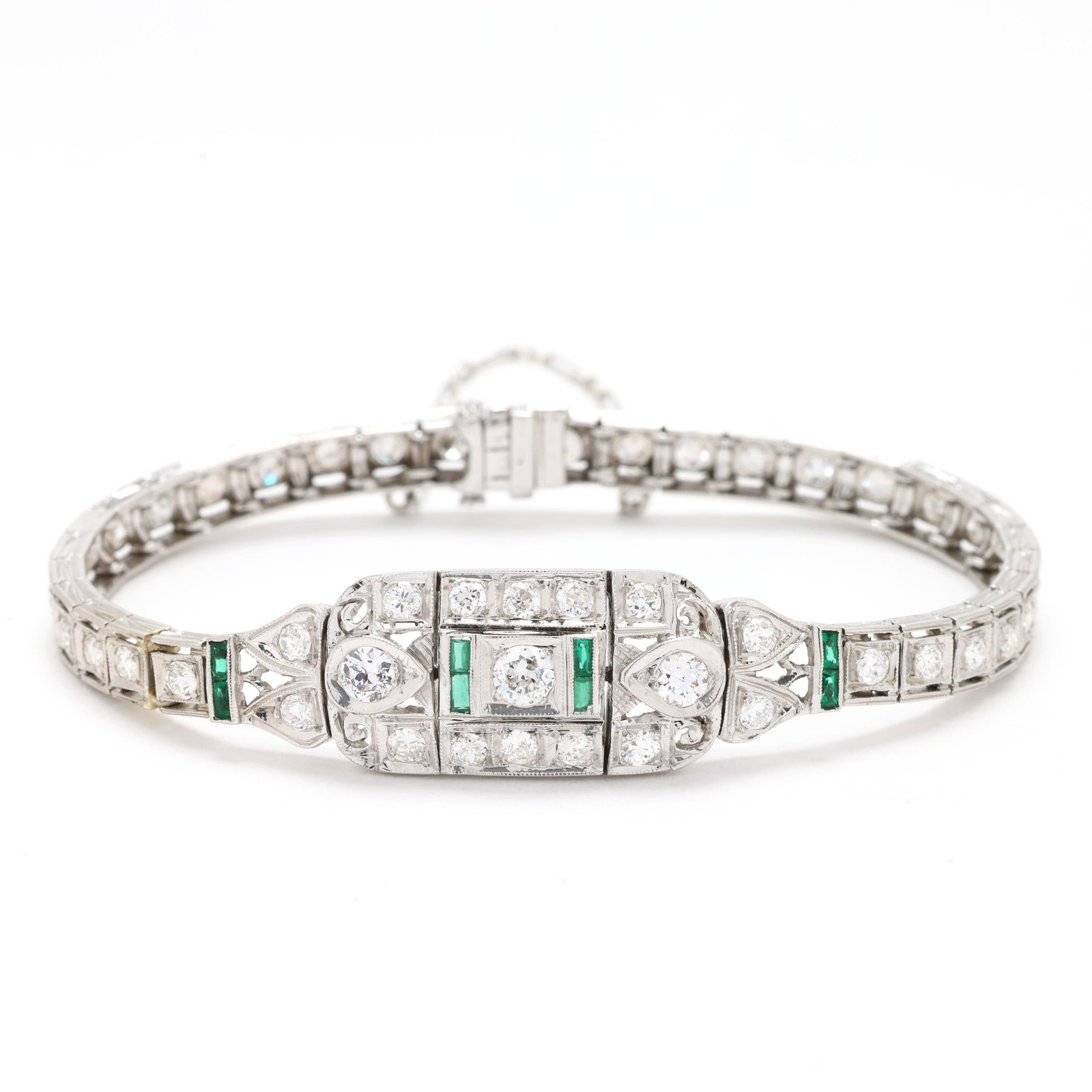 Art Deco White Gold and Diamond Bracelet: Art Deco White Gold and Diamond Bracelet the central cartouche with filigree design in geometric, scroll, and acanthus leaf motifs, with baguette cut synthetic emerald accents, the whole set with full