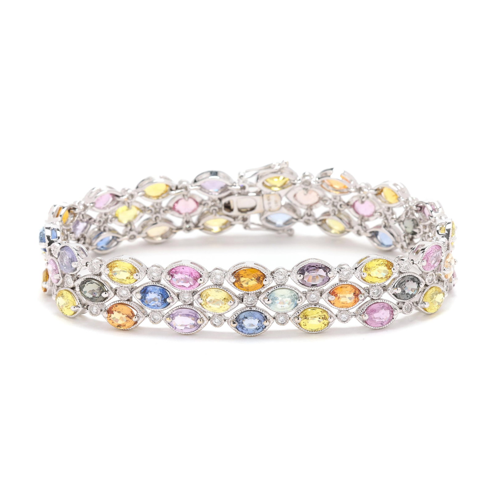 White Gold and Multi-Color Sapphire Bracelet: White Gold and Multi-Color Sapphire Bracelet set with three rows of oval cut sapphires in varying colors and tones, with milgrain detailing and full cut round diamond melee spacers, completed with an