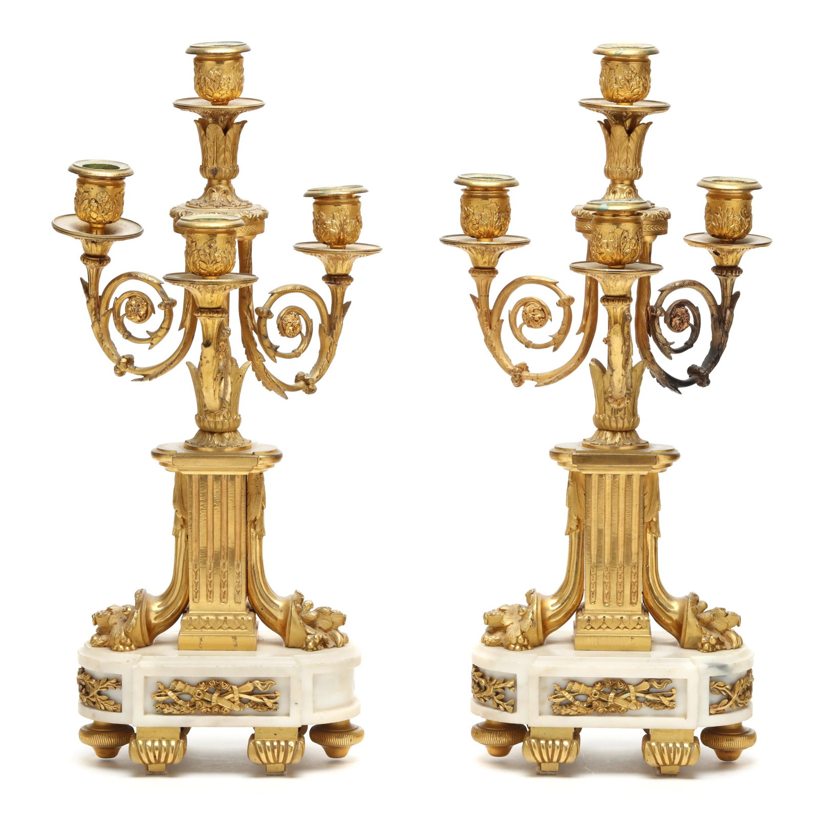 Pair of Antique Louis XVI Style Ormolu and Marble Four-Light Candelabra: Pair of Antique Louis XVI Style Ormolu and Marble Four-Light Candelabra France, 19th century, fluted monument base flanked by spreading cornucopia, issuing three scrolled arms and a single central ris