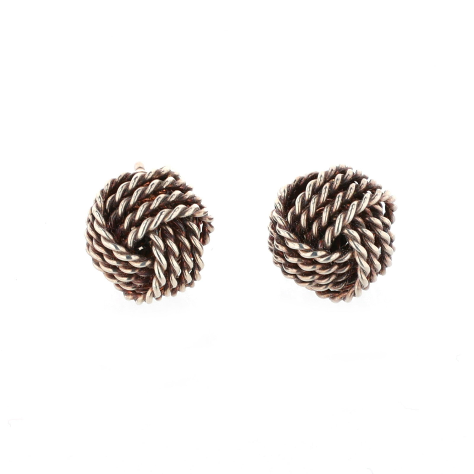Silver Knot Motif Earrings, Tiffany & Co.: Silver Knot Motif Earrings, Tiffany & Co. in a four-strand knotted rope twist design, completed with posts and push backs, posts and backs stamped 925 and with maker's mark. 9.5mm .085 troy oz. Additi