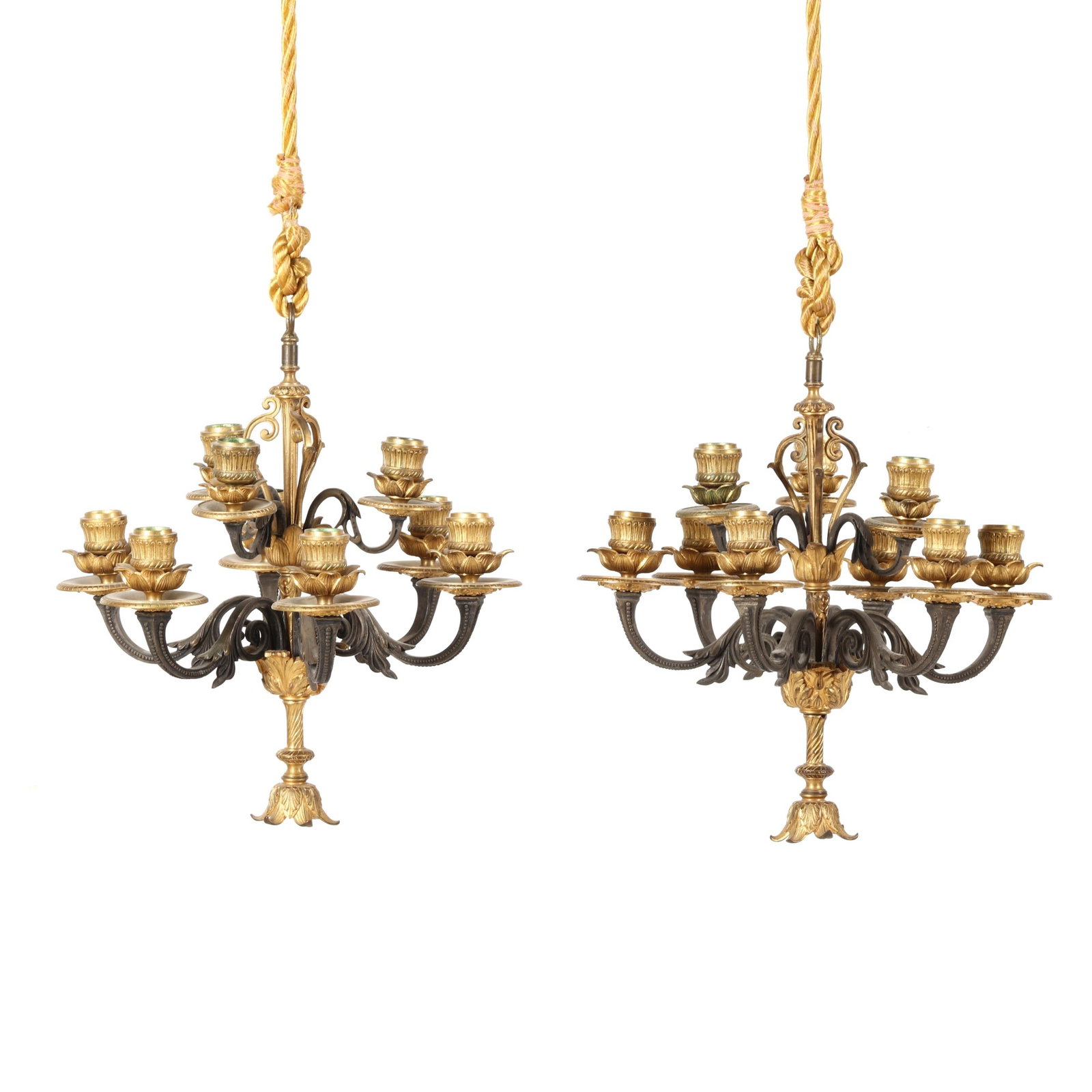 Pair of French Neoclassical Bronze Nine-Light Hanging Candelabra: Pair of French Neoclassical Bronze Nine-Light Hanging Candelabra late 19th century, patinated and gilt bronze, unmarked, featuring two tiers of upswept branch arms terminating in budding sconces, unma