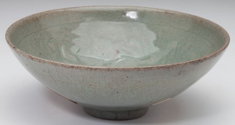 Korean Celadon Glazed Molded Bowl: Korean Celadon Glazed Molded Bowl likely Koryo period (12th-13th century), the interior with molded foliate design. 2 5/8 x 7 1/8 in. diameter Collection of Brigadier General John Weckerling, acquired