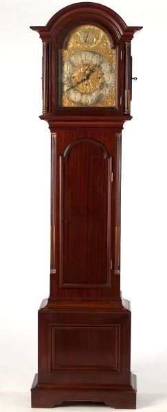 German Colonial Revival Tall Case Clock: German Colonial Revival Tall Case Clock early 20th century, mahogany case featuring an arched hood with cove molding above a silver repousse brass face having dial to regulate chime/silent and a secon