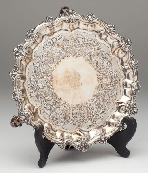 William IV Silver Salver by James Charles Edington: William IV Silver Salver by James Charles EdingtonLondon (1831) hallmarks, circular form with boldly cast shaped shell decorative rim, raised on three scroll feet, the maker's mark on the underside, t