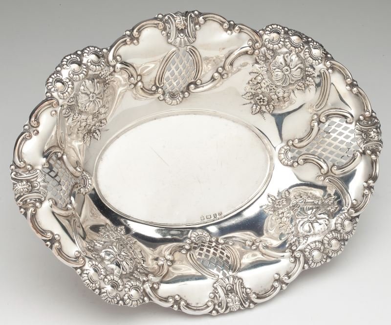 Edwardian Silver Basket: Edwardian Silver Basket Birmingham (1902) hallmarks, sponsor's mark for Boardman Glossop & Co. Ltd., oval form with reticulated panels alternating with floral chased decoration. 2.25 x 12.25 x 9 in. 1