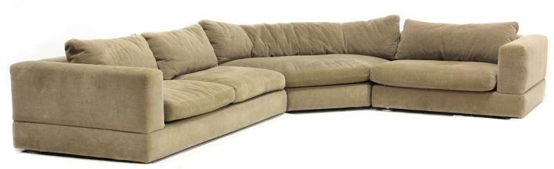 Custom Minotti Sectional Sofa: Custom Minotti Sectional Sofafrom the Nolan collection, plush tan upholstery on raised circular metal feet, 24 x 114 x 139 in.With original brochures.