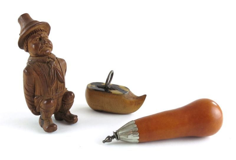 Collection of Three Antique Whimsical Snuff Boxes: Collection of Three Antique Whimsical Snuff Boxes each late 19th century, the first a carved wood seated German man with loose head-lid; the second a Dutch shoe with tortoise shell and ring handle lid