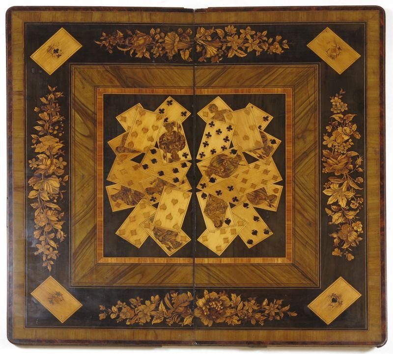 Continental Marquetry Trompe-l'Å“il Card Board: Continental Marquetry Trompe-l'Å“il Card Board two part with central hinges, the center with light and dark wood inlaid playing cards, the outer border with inlaid floral design. 31 x 31 in. (open)