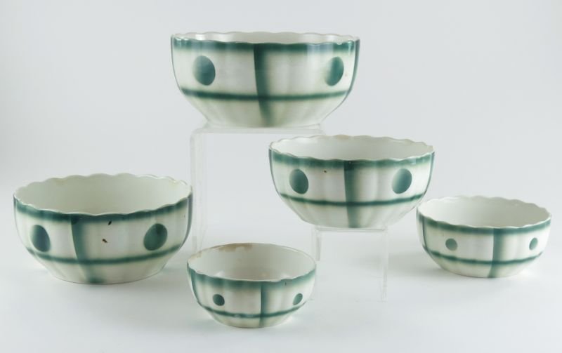 German Art Deco Nesting Bowl Set: German Art Deco Nesting Bowl Setfive nesting bowls with green stenciled designs, marked.Largest 4 x 8.75 in.
