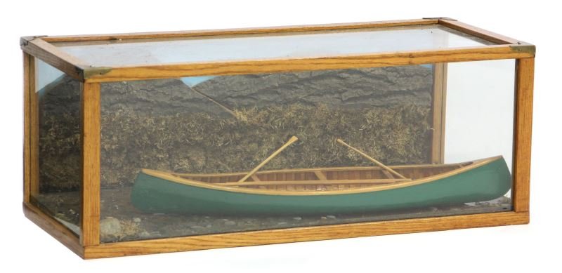 Canoe Model Made by The Sharp Canoe Co.: Canoe Model Made by The Sharp Canoe Co.mid 20th century, retains label reading "Replica of Canoe Used on the Ristagouche and Matapedia Rivers in Quebec, Canada," presented as a diorama in a glass and