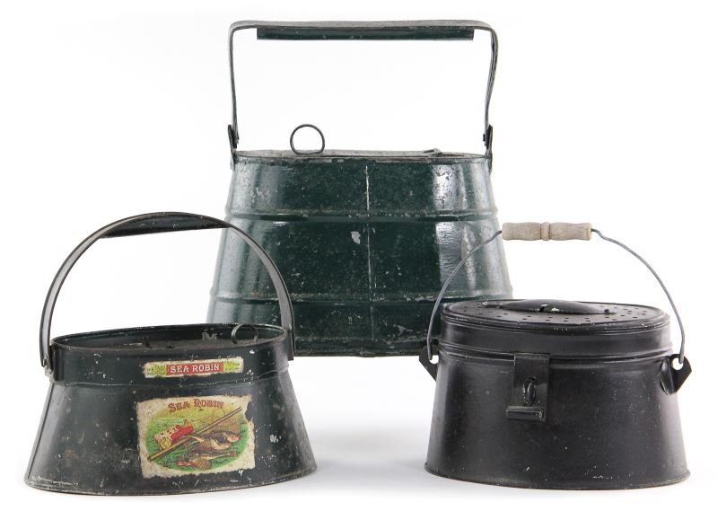 Three Antique Tin Angler's Cricket Tins: Three Antique Tin Angler's Cricket Tinsearly 20th century, the first with decals advertising Sea Robin cigars, half-hinge lid with punched stars (9 in.); oval form with wood and wire handle (9.5 in.);