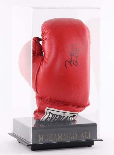 Muhammad Ali Signed Boxing Glove: Muhammad Ali Signed Boxing Glovea red Everlast black laced glove within plexiglass case, with Certificate of Authenticity.DOA of case 15 x 8.25 x 6.75 in.Selected objects from The Bob Timberlake Colle