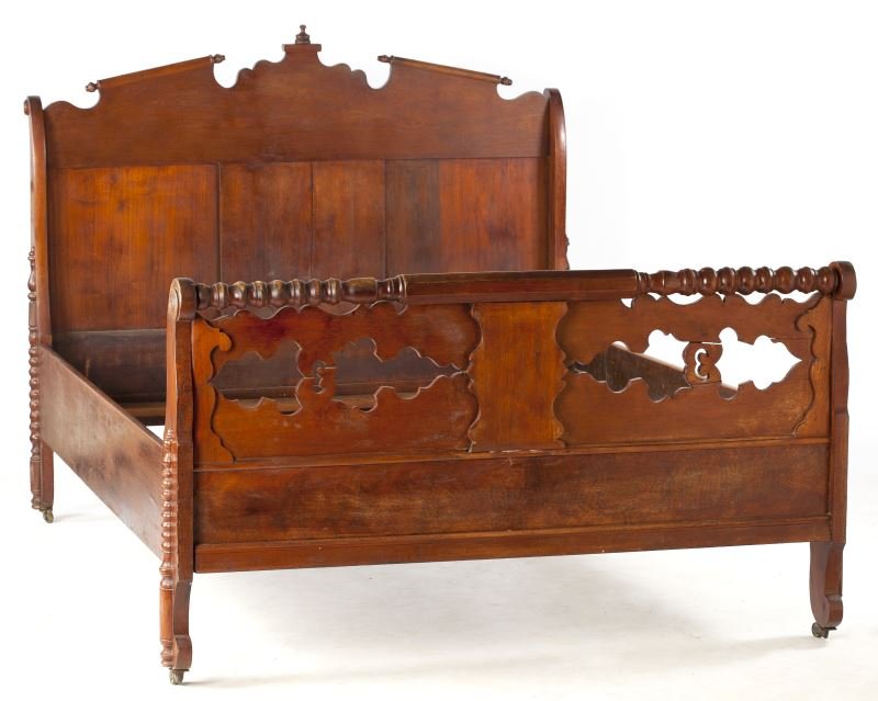 Thomas Day Cottage Bed, NC: Thomas Day Cottage Bed, NCmid 19th century, constructed of mahogany, mahogany veneer and yellow pine, the headboard is shaped and centered with a finial, the footboard with quilt rail flaked by spool