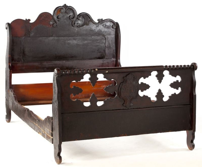 Thomas Day Cottage Bed, NC: Thomas Day Cottage Bed, NCmid 19th century, mahogany and mahogany veneers, the headboard with applied scroll decoration, the footboard with decorative cut outs below a spool turned quilt rail.53 x 84