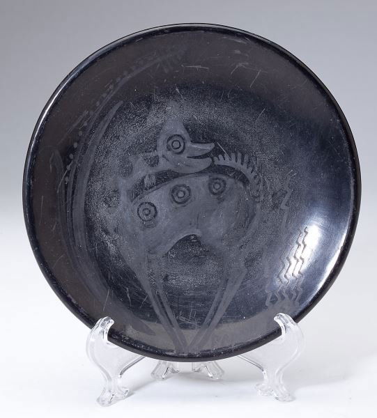 Maria Poveka San Ildefonso Blackware Dish: Maria Poveka San Ildefonso Blackware Dishmid-20th century, signed on underside, additionally signed "Papovi" on the inner rim, decorated with an antelope and corn plant.6.25 in. diameter