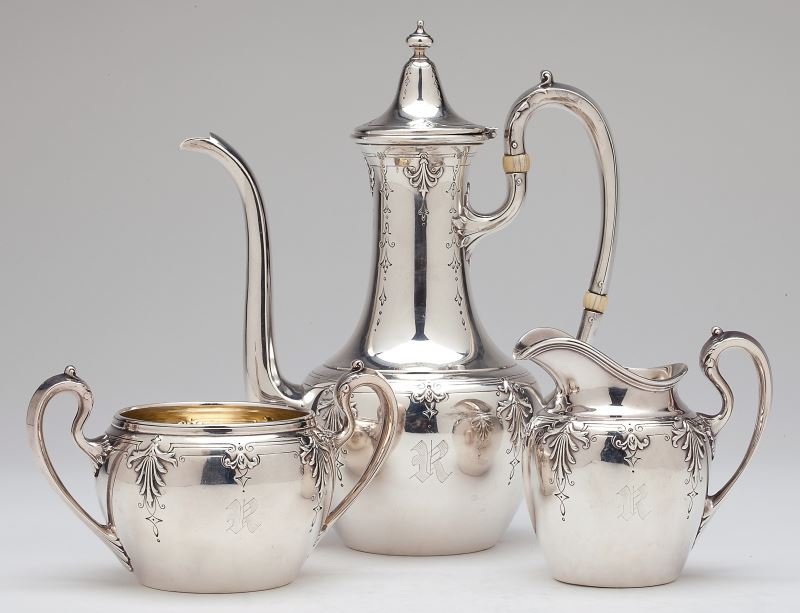 Reed & Barton Sterling Silver Demitasse Set: Reed & Barton Sterling Silver Demitasse Set early 20th century, the three piece set including a demitasse pot (8 in.), open sugar with gilt interior, and cream jug. The pot with subtle Middle Eastern 