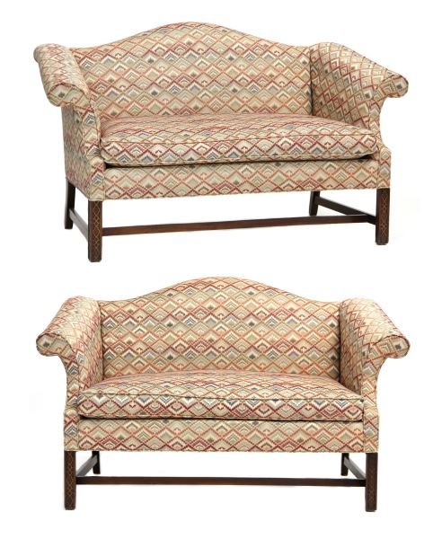 Pair of Hickory Chair Settees: Pair of Hickory Chair Setteescamel backs with scrolled arms raised on four legs with stretcher base, the front legs with Chinese Chippendale style fretwork, Hickory Chair label to underside.34.5 x 58