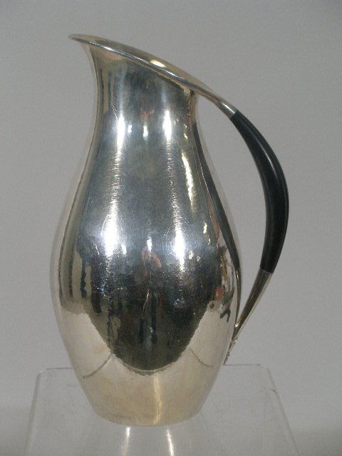Georg Jensen Sterling Silver Pitcher,: Georg Jensen Sterling Silver Pitcher,designed by Johan Rohde, of elongated baluster form w/rolled rim and inset ebony handle w/foliate terminal, lightly hammered surface, w/Jensen hallmarks and "432F"
