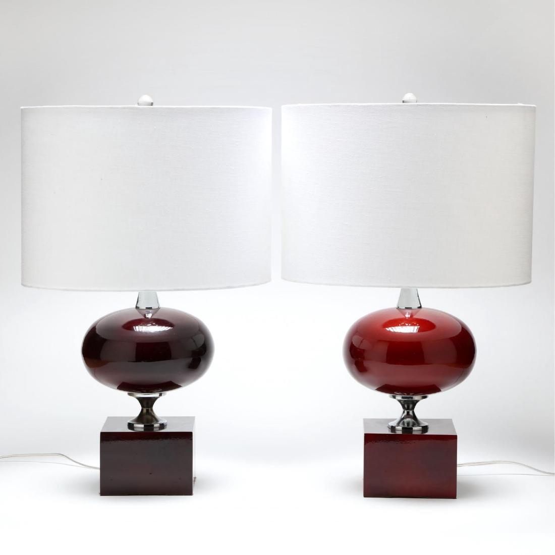 Philippe Barbier, Pair of Table Lamps: French, 1970s, deep red lacquer and chrome, white linen drum shades, lamps unmarked, shades marked "Ro Sham Beaux." HOA 26 in. Additional high-resolution photos are available at LelandLittle.com