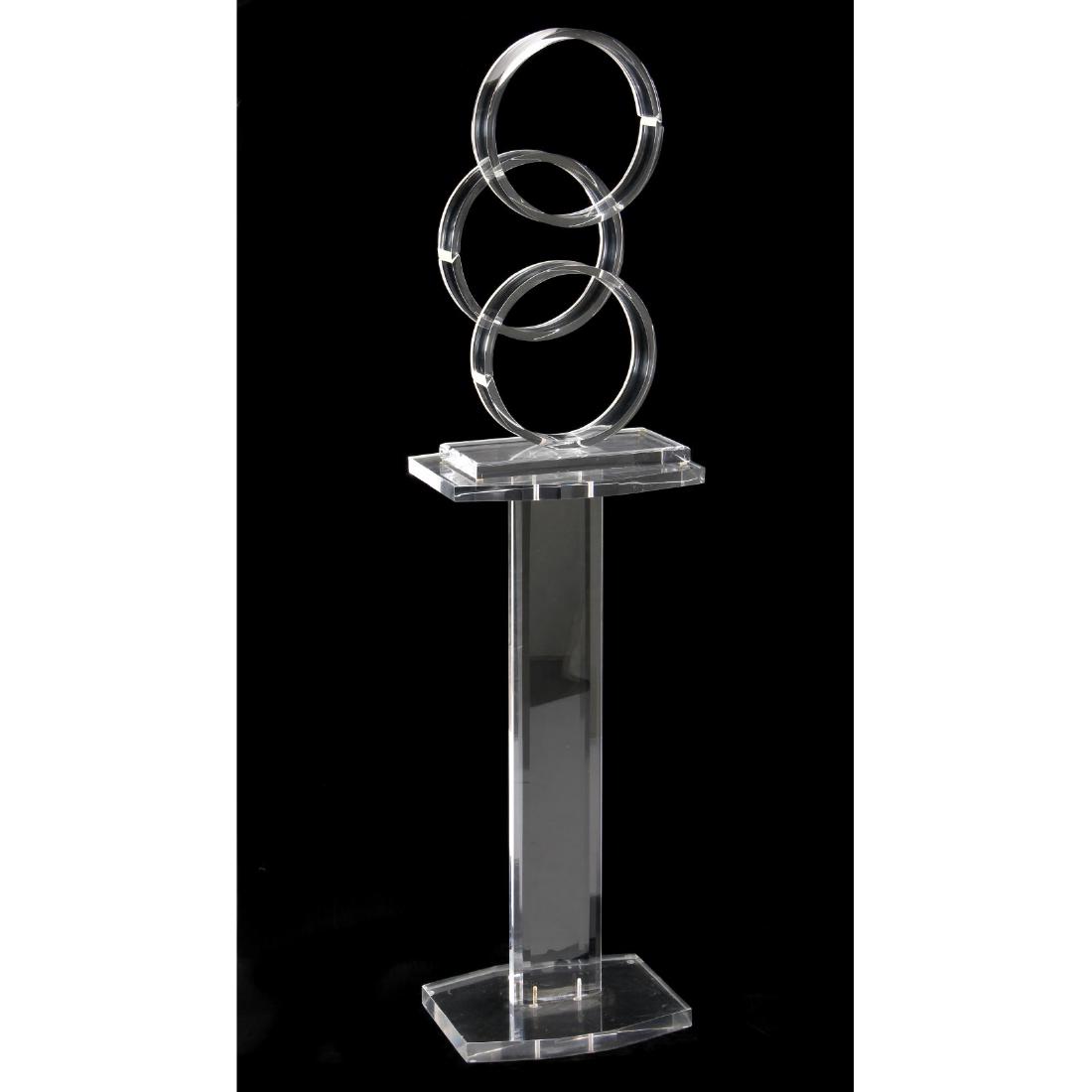 Van Teal, Lucite Sculpture on Stand: 1980s, three ring sculpture signed "Van Teal" presented on a likely original lucite base. DOA 62 x 16 x 12 in. Chapel Hill Estate Additional high-resolution photos are available at LelandLittle.com