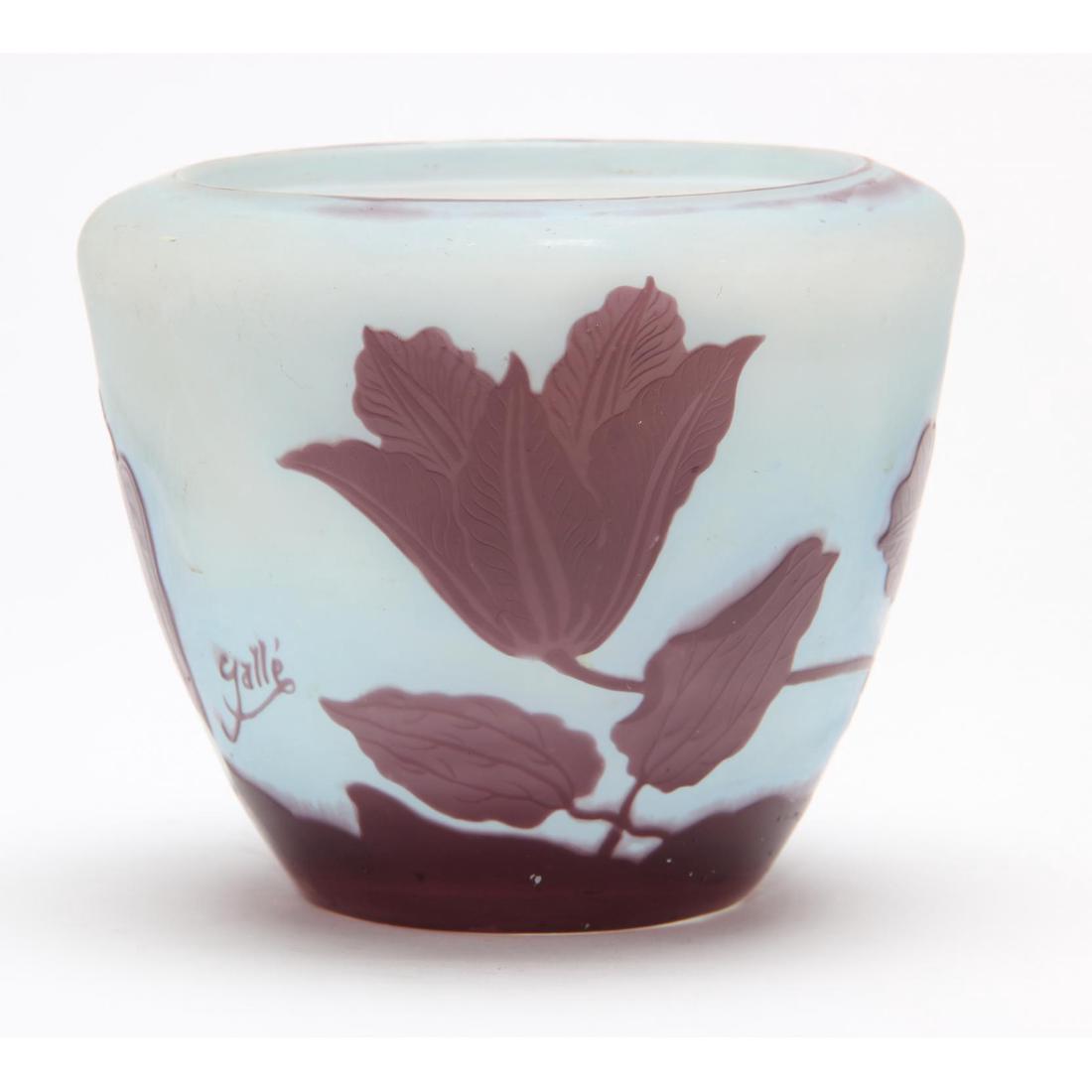 Galle, Cameo Glass Vase: France, circa 1900, purple over opaque glass, hibiscus design, polished pontil and base, signed. 5 x 6 in. diameter. Estate of Connie Van Pelt, Fond du Lac, WI Additional high-resolution photos are av