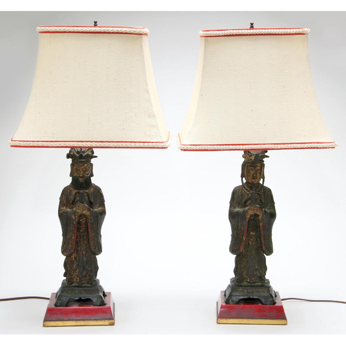 Pair of Chinese Bronze Figures of Scholars: each presented as a custom vintage decorative table lamp mount in the style of Frederick Cooper, each bronze figure with remnants of gilding and polychrome paint, with attractive silk shades. 25 in. E